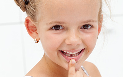 Child with missing tooth