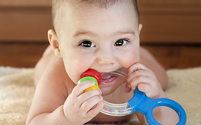 Baby with chew toy