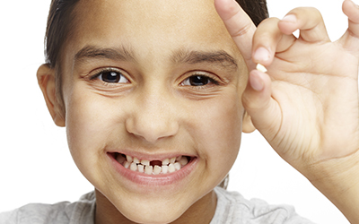 Girl with missing teeth