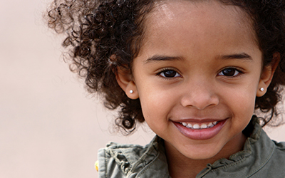 A young girl smiling