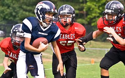 A group of kids playing football