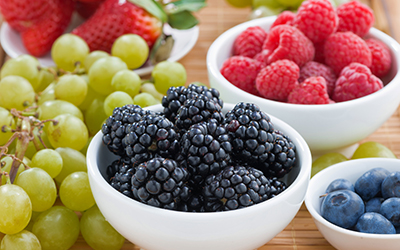 Bowls o different kinds of fruit