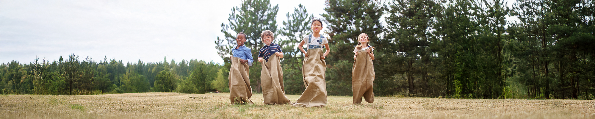 Children playing relay-race outdoors