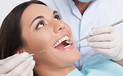 Teenage woman in dental chair