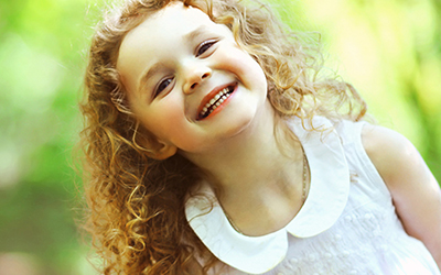 A young girl smiling