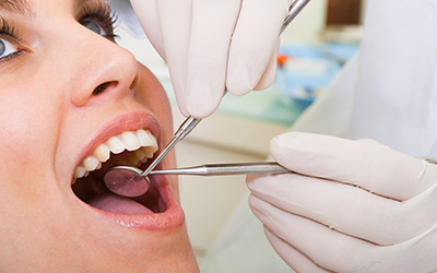 Woman havng teeth exam