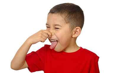 Child plugging his nose